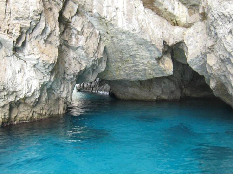 Turquoise water inside a sea grotto on Capri