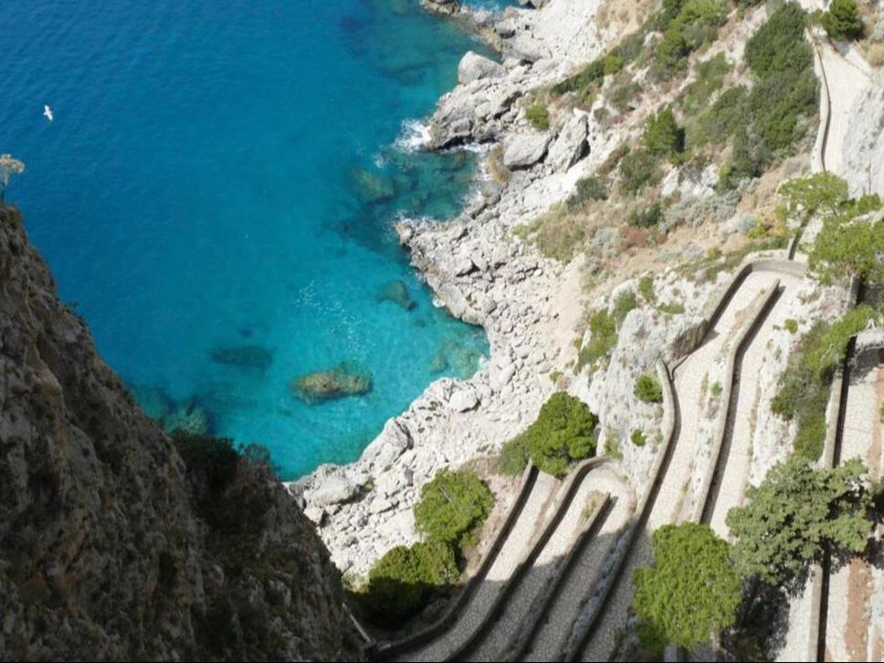 Via Krupp hairpin road winding down the cliffs of Capri to the sea