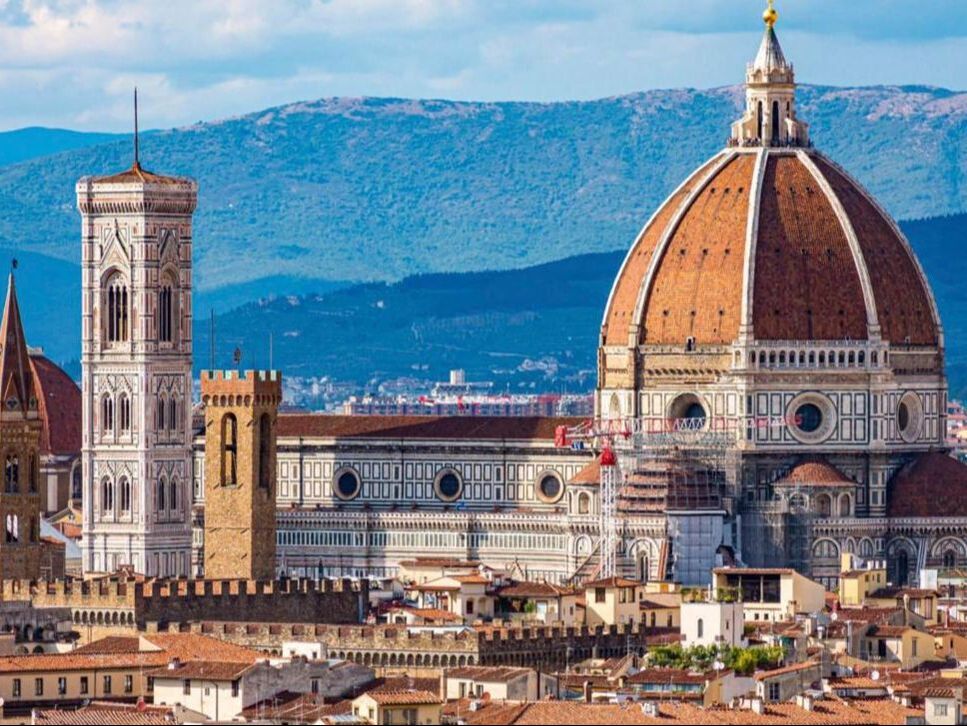 Florence Cathedral dome and Giotto's bell tower above the city rooftops