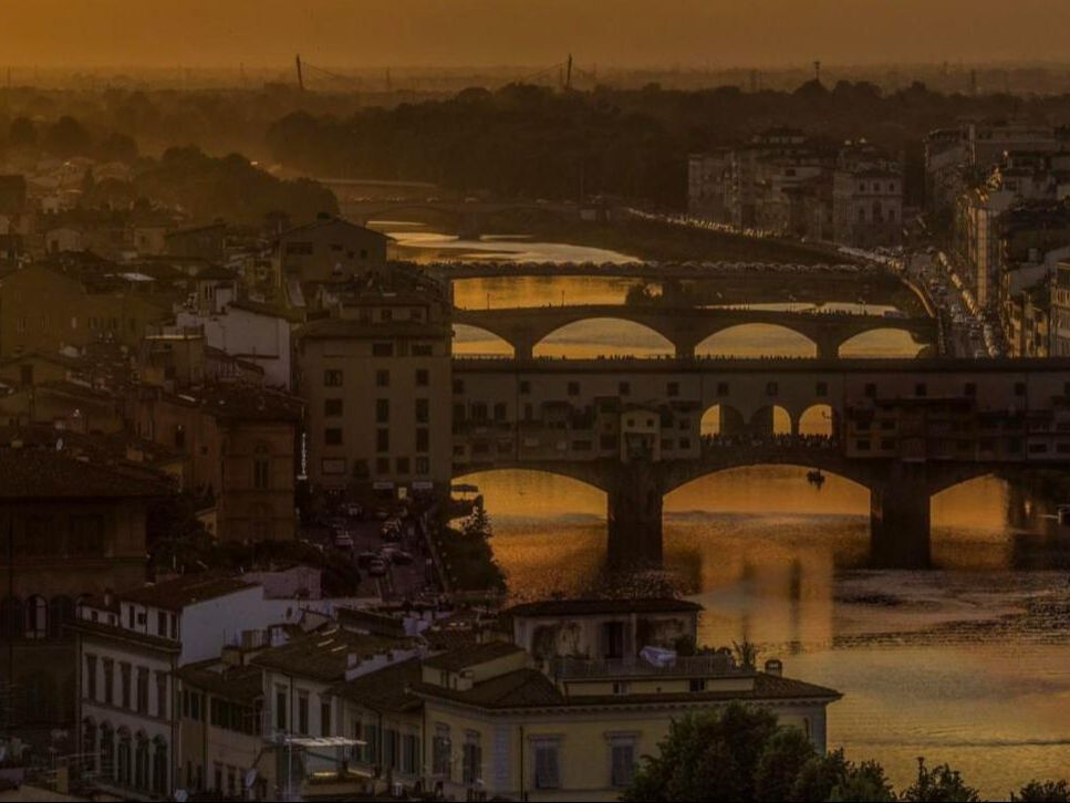 Ponte Vecchio and the Arno river at sunset in Florence