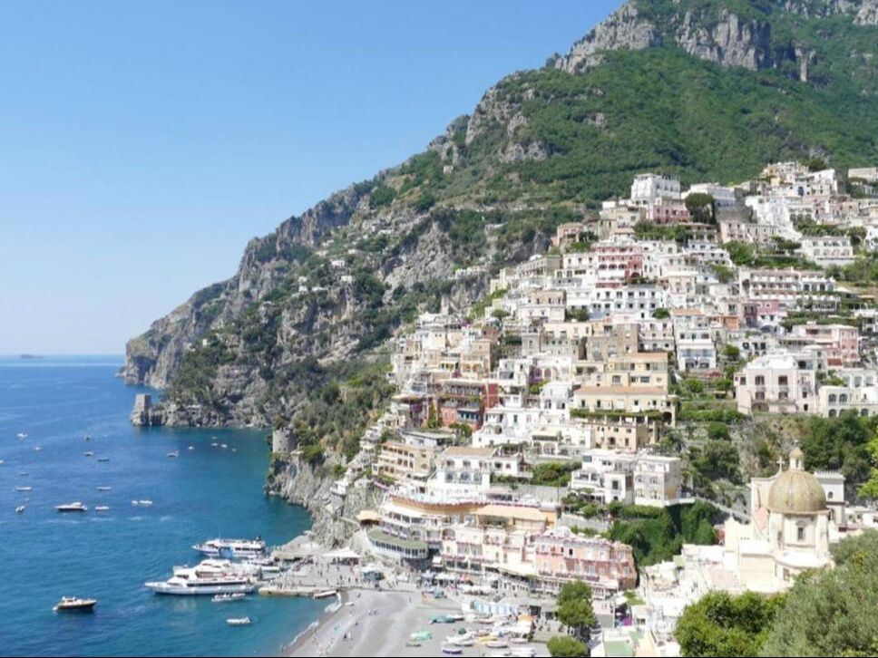 Panoramic view of Positano's cliffside houses and beach on the Amalfi Coast