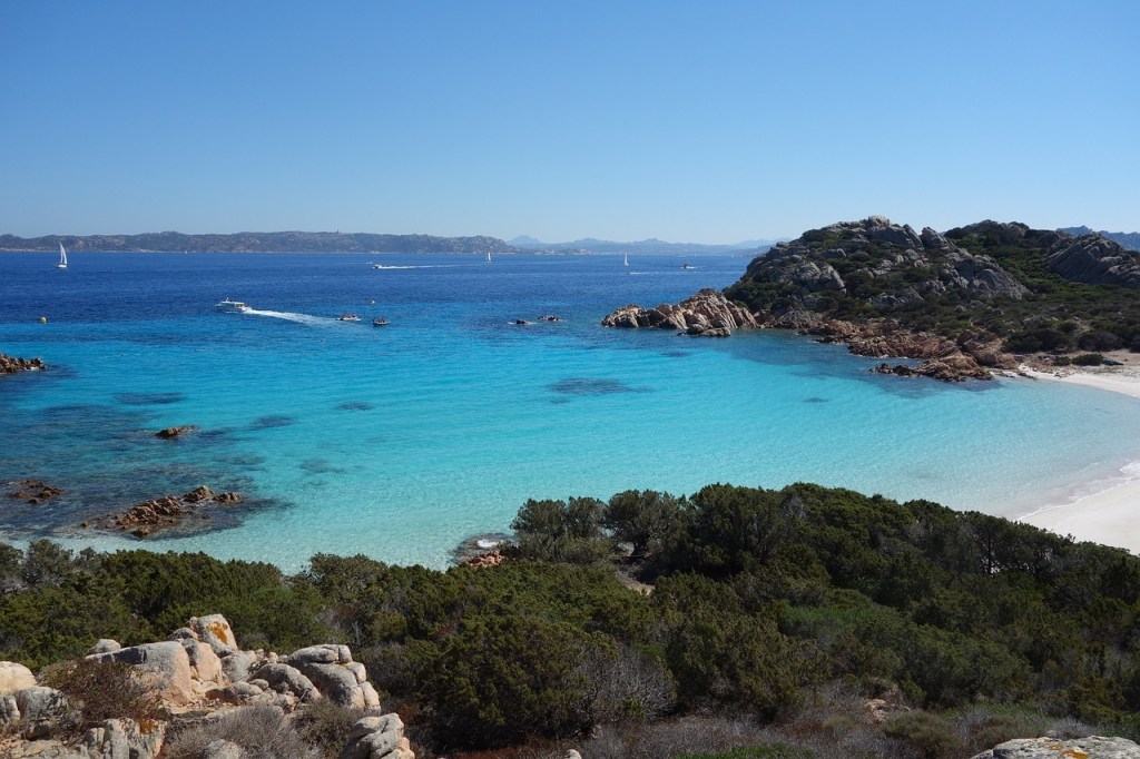 Turquoise water and white sand on a beach in Sardinia