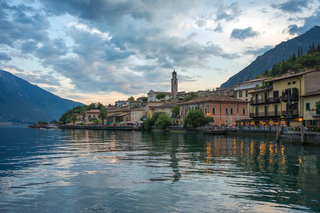 A harbour with boats and pastel houses on Lake Garda
